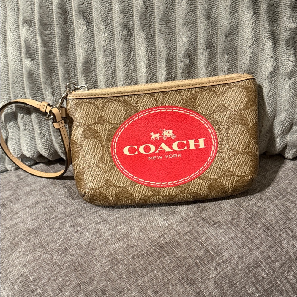 Coach Tan Wristlet with Red Emblem